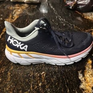 Hoka Navy and White Athletic Shoes with Orange and Pink Accents